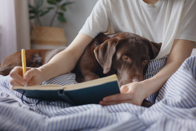 Midsection of woman with dog