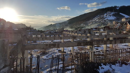 Bridge over river during winter