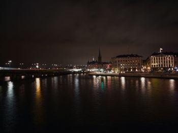 Illuminated buildings at waterfront