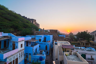 High angle view of townscape against sky at sunset