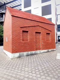 Brick wall with building in background