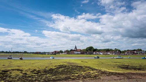 Scenic view of landscape against cloudy sky