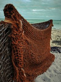 Close-up of fishing net on beach