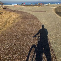 Shadow of man on field