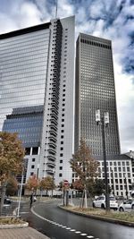 Low angle view of office building against sky