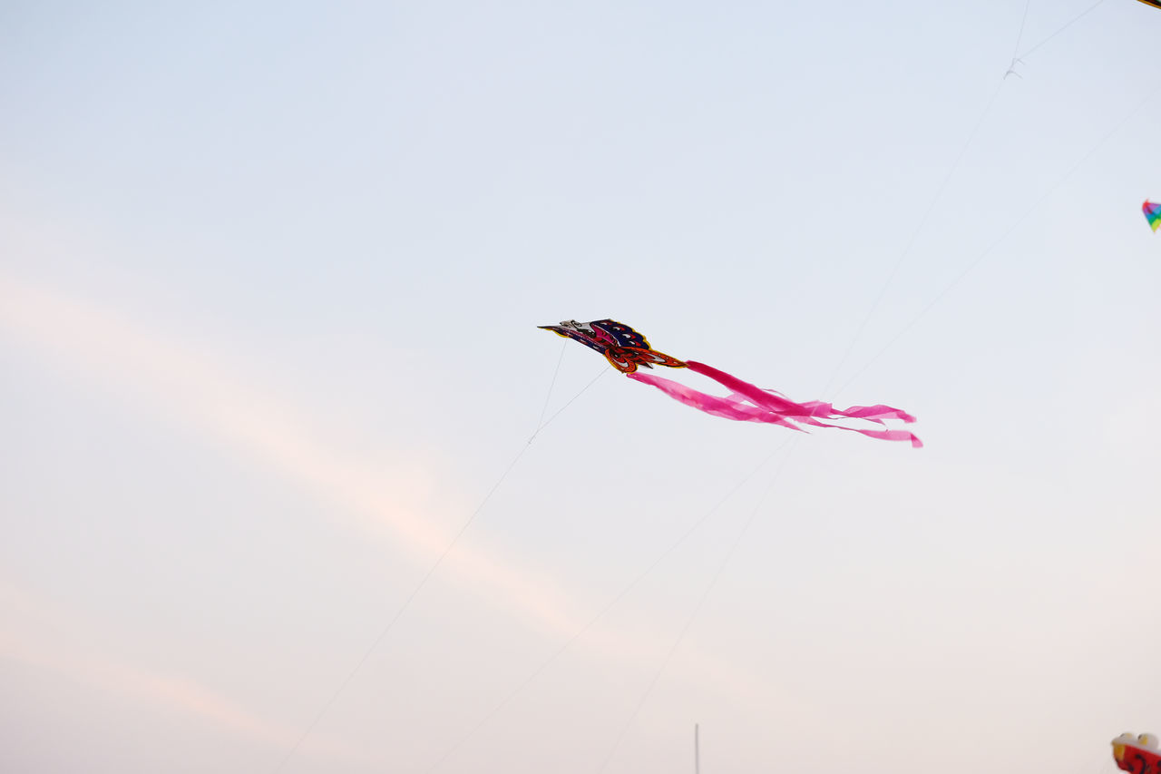 LOW ANGLE VIEW OF KITE FLYING IN SKY