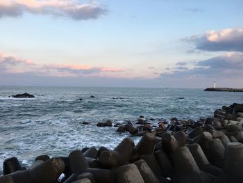 Scenic view of sea and rocks against sky