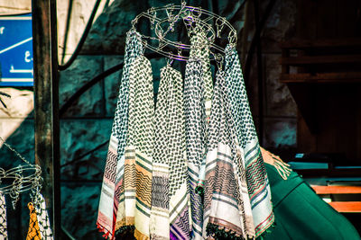 Close-up of decorations hanging at market stall