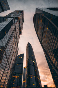 Low angle view of buildings against sky during sunset