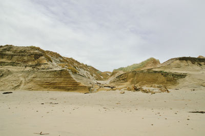 Scenic view of sand against sky