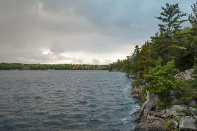 View of calm sea against cloudy sky