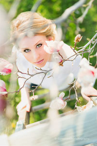 Portrait of woman with pink flowers