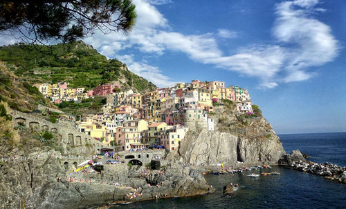 Panoramic view of townscape by sea against sky