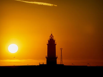 Silhouette of building during sunset