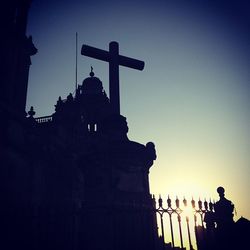 Low angle view of church against sky at sunset