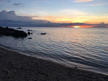 Scenic view of sea against sky during sunset