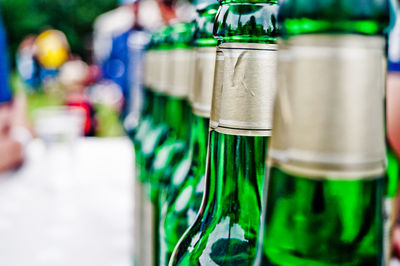 Close-up of beer bottles on table