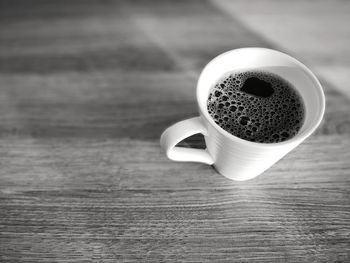 High angle view of coffee cup on table