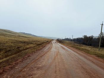 Road amidst landscape against clear sky