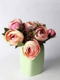 Close-up of rose bouquet against white background