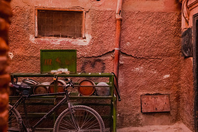 Bicycle parked against wall