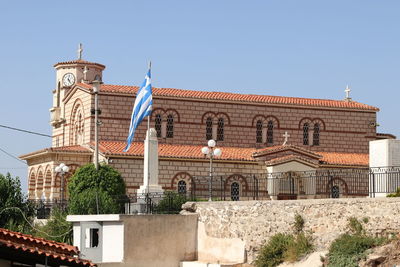 Low angle view of historical building against clear blue sky