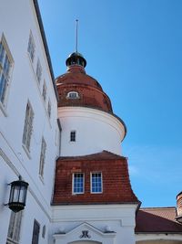 Low angle view of a castle at a blue sky