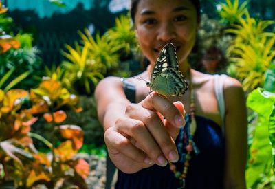 Portrait of woman with butterfly