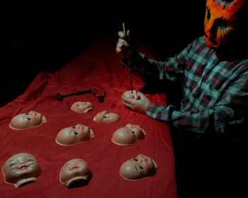High angle view of stuffed toy against black background