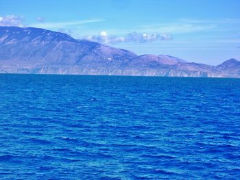 Scenic view of sea against blue sky