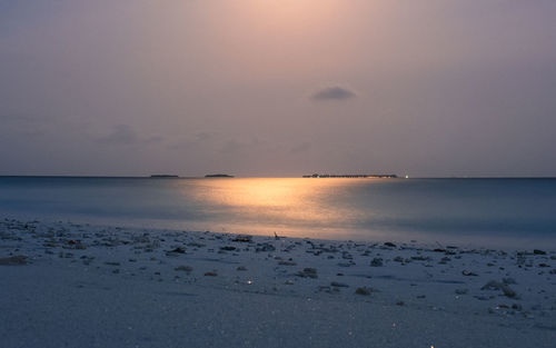 Scenic view of sea against sky at sunset