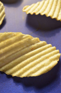 Close-up of potato chips on table