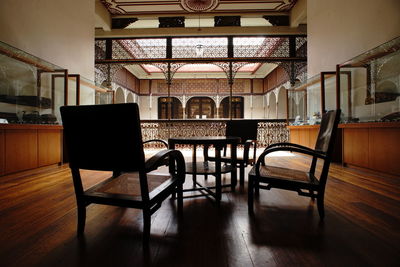 Empty chairs and table at blue mansion