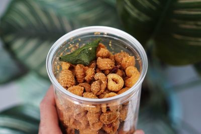 High angle view of person preparing food in container