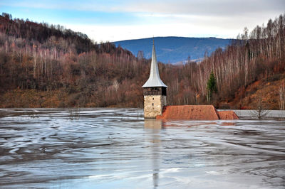 Flooded church by contaminated water and mud. geamana, romania