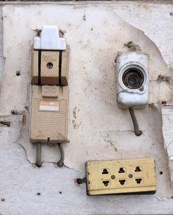 Close-up of electric lamp on wall