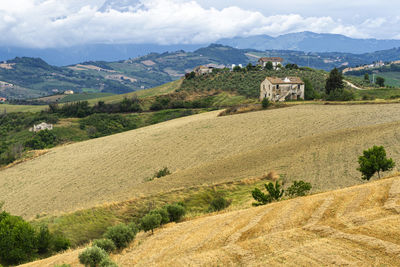 Scenic view of landscape and mountains against sky