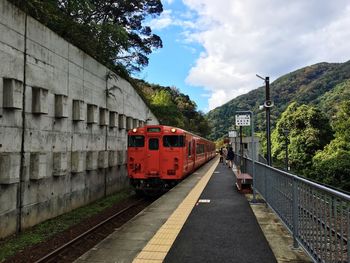 Train on railroad track against sky