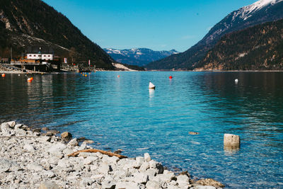 Scenic view of lake and mountains against sky