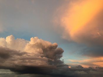 Low angle view of cloudy sky during sunset