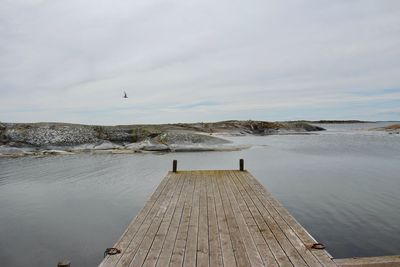 View of pier on sea against sky