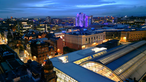 Illuminated buildings in city at night