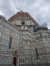 Low angle view of cathedral against cloudy sky