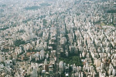 High angle view of crowd against buildings in city