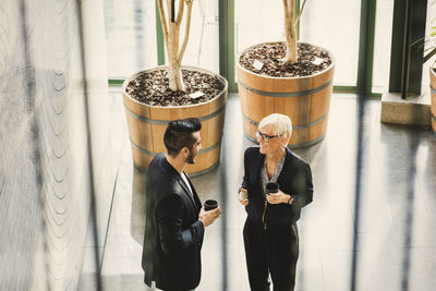 High angle view of business people discussing at office