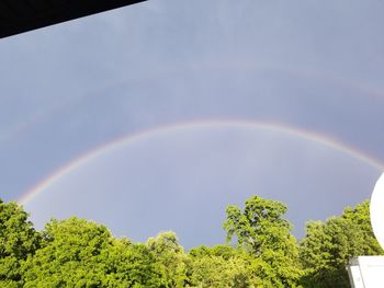 Low angle view of rainbow against sky