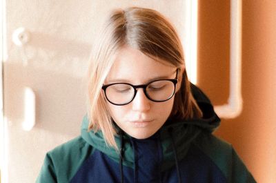 Close-up portrait of woman with eyeglasses