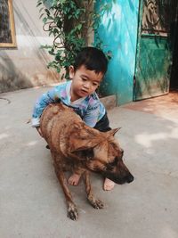 Cute girl sitting with dog