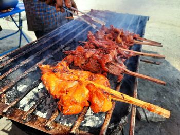 High angle view of meat on barbecue grill