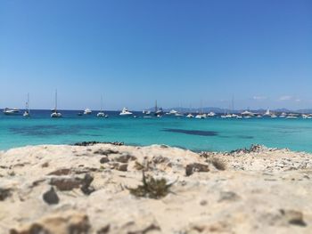 Scenic view of sea against clear blue sky